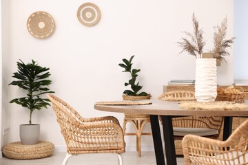 Stylish table with chairs and decor in dining room. Interior design
