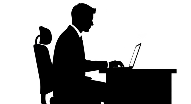 Silhouette of a man using a laptop