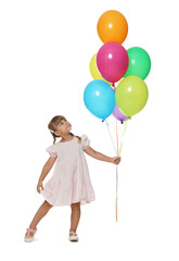 Cute little girl in dress with bunch of colorful balloons on white background