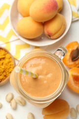 Superfood. Tasty smoothie and ingredients on white table, flat lay