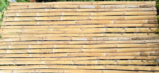 Fence, Bamboo litter or bamboo cot. Seats or mattresses made from woven bamboo sheets. Use natural materials to make furniture. Made from woven bamboo sheets - strips. Can be applied in variety of way