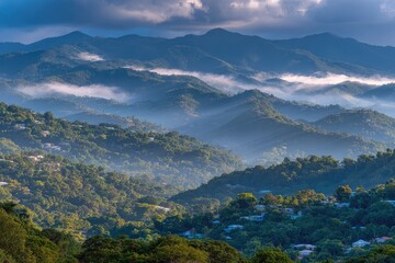Fototapeta premium Misty mountain range with valleys and settlements