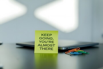 Sticky note, Keep going, You're almost there. 