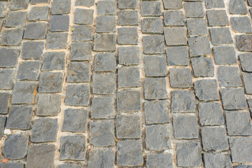 Paving stones on floor in parking lot,Concept of laying paving slabs and pavers,Textured concrete for gray floors,Concrete pavement blocks,space for text.