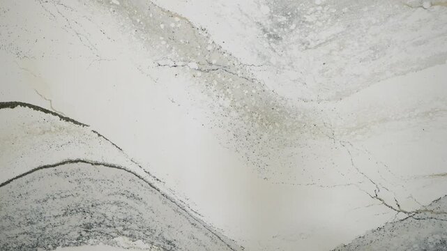 This marble texture has intricate patterns, ideal for luxurious designs and elegant backgrounds that impress