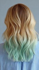 Naklejka premium Photo of a woman with striking blonde hair featuring a beautiful pastel green ombre effect transitioning from roots to tips showcasing a modern and stylish hairstyle