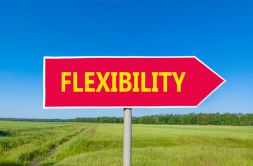 Flexibility symbol. Concept word Flexibility on beautiful red road sign. Beautiful blue sky green grass and forest peaceful nature background. Business flexibility concept. Copy space.
