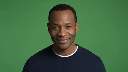 Confident Black Man Smiling, Green Screen, Subtle Head Movement, Positive Emotion,  Broadcast Quality