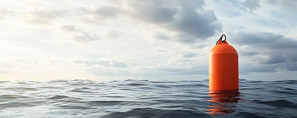 An orange buoy floats on a wavy ocean with cloudy skies