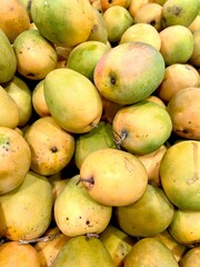 Gedong Gincu mango. An Indonesian tropical fruit from Majalengka, West Java. With its fragrant aroma and sweet taste, it's displayed at a fruit market.