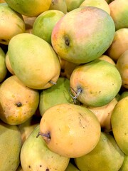 Gedong Gincu mango. An Indonesian tropical fruit from Majalengka, West Java. With its fragrant aroma and sweet taste, it's displayed at a fruit market.