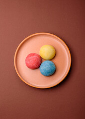 Japanese mochi, ice cream or Asian sweets with fruit filling. Mochi of different colors