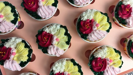 cupcake with colorful flower-shaped butter cream