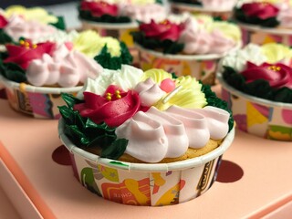 cupcake with colorful flower-shaped butter cream