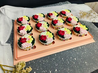 cupcake with colorful flower-shaped butter cream