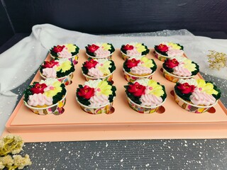 cupcake with colorful flower-shaped butter cream