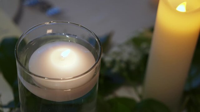 A captivating and charming dinner setup showcasing an elegant menu, beautiful candles, and exquisite floral decor