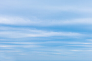Beautiful blue sky and white fluffy group of clouds background in the morning skyline