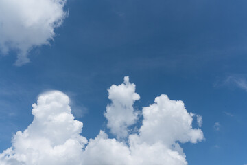 huge cumulus clouds in the blue sky
