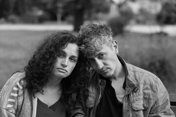 Portrait of homeless people outdoors. Black and white effect