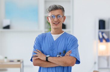 Portrait of doctor in scrubs at clinic