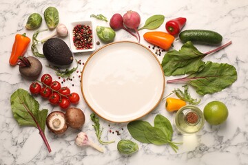 Healthy vegetarian food. Empty plate surrounded by different products on white marble table, flat lay