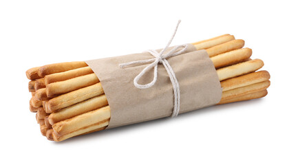 Many delicious grissini sticks isolated on white