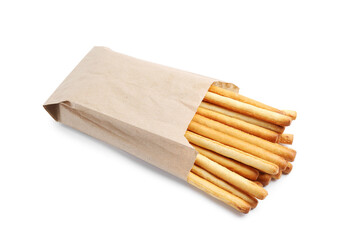 Delicious grissini sticks in paper bag isolated on white