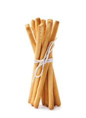 Many delicious grissini sticks isolated on white