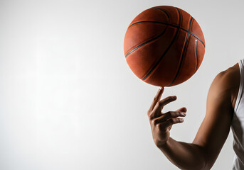 Basketball player spinning ball on finger isolated on white background