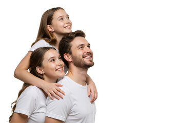 Optimistic family portrait of a handsome father and his two beautiful daughters looking up with joy on a white background.