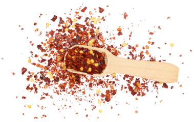 Spicy chili red pepper flakes, chopped, milled dry paprika pile in wooden sppon isolated on white, top view