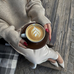 woman holding cup of coffee