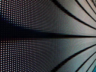 Close-up of illuminated LED display panel with grid pattern