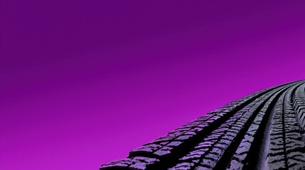 Close-up of tire tracks on vibrant purple background