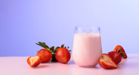 Strawberry yogurt and fresh berries on a colorful background.