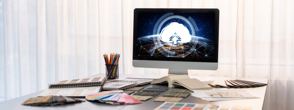 Interior designer workspace table and architecture software on laptop screen with mood board materials and colorful swatch color for color selection. Modern interior design office. Insight