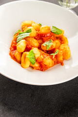 Gnocchi tomato sauce fresh delicious gourmet food background on the table  rustic food top view copy space