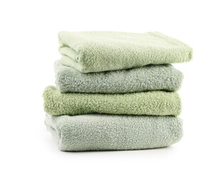 Stack of soft green towels isolated on white