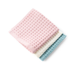 Clean colorful waffle towels isolated on white, top view