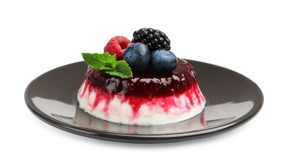 Delicious panna cotta with berries, jam and mint isolated on white