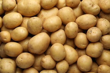 Fresh raw potatoes as background, top view