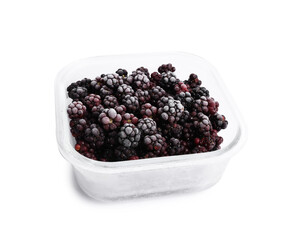 Frozen blackberries in glass container isolated on white
