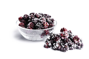 Many ripe frozen blackberries isolated on white