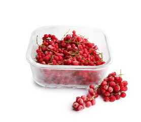 Frozen currants in glass container isolated on white