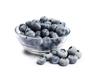 Frozen blueberries in glass bowl isolated on white