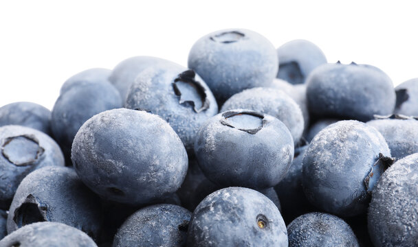 Heap of frozen blueberries on white background, closeup