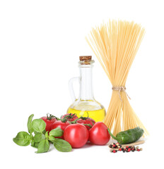 Raw spaghetti pasta and different ingredients isolated on white