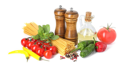 Raw spaghetti pasta and different ingredients isolated on white