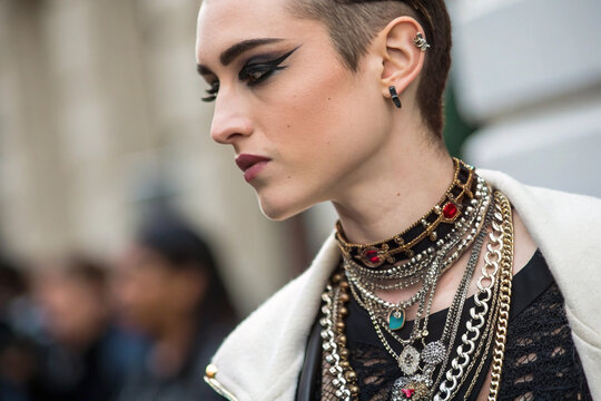 Trendy model portrait with bold makeup and chains. Great for editorial use, articles, or beauty and fashion projects.